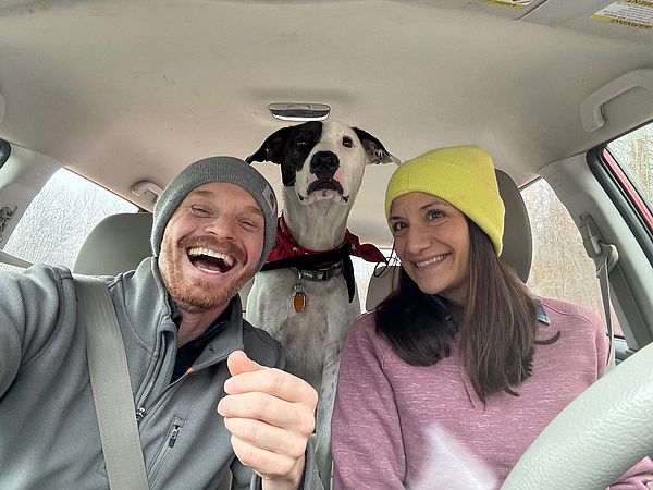a picture of farmer Tyler Rich and his wife Jenna and their dog. 