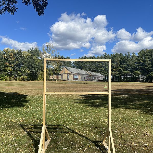 This image shows a mock up design of our new headquarters, placed in its approximate position adjacent to Ashuelot River Park. 