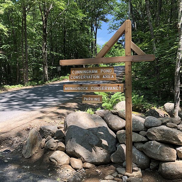 a picture of the trailhead for the Cunningham Pond Trail - there is a sign that says "Cunningham Pond Trail"
