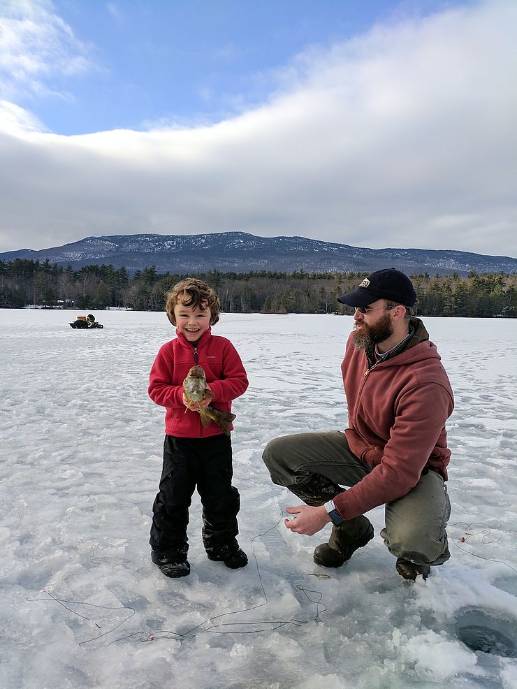 Henry Owens and Rick Brackett showing off their ice-fishing catch