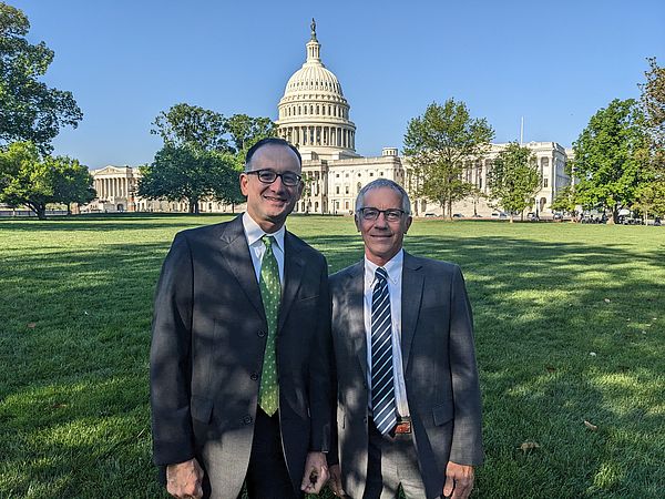 Ryan Owens and Peter Kenyon standing in front of the capitol building in Washington DC