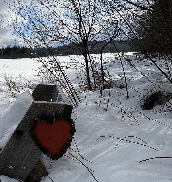 A paper heart hangs over the Gramwick Trail in Jaffrey 