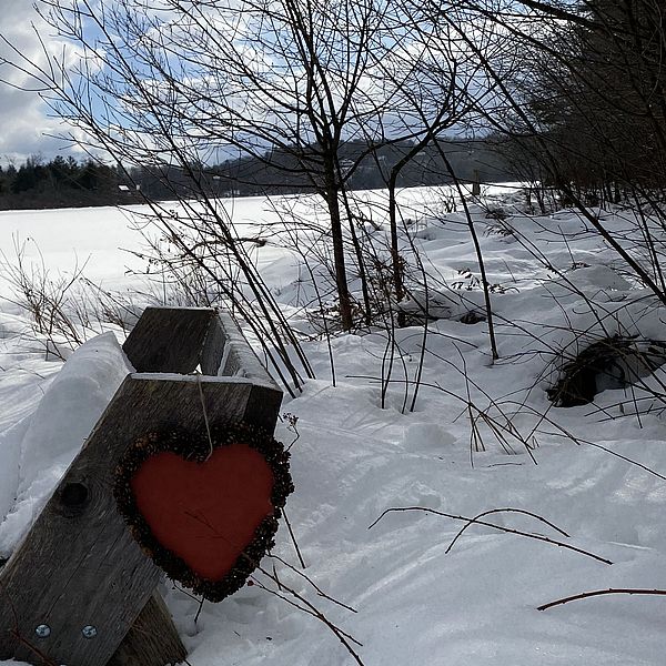 A paper heart hangs over the Gramwick Trail in Jaffrey